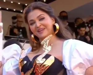 Dressed in black & gold gown, Aishwarya walks the red carpet at Cannes with injured arm in cast