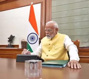 PM Modi signs first file for farmers welfare