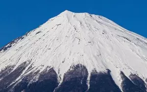 Mount Fuji observes seasons first snowcap, latest ever in 130 years