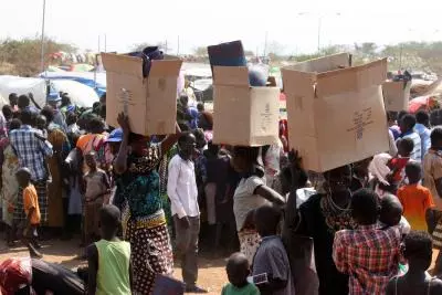 Food aid convoy arrives in refugee camp in Sudans North Darfur State