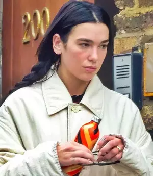 Dua Lipa flaunts engagement ring as she runs errands in London