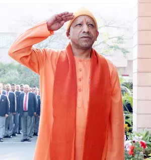 CM Yogi hoists national flag at official residence, extends greetings to citizens