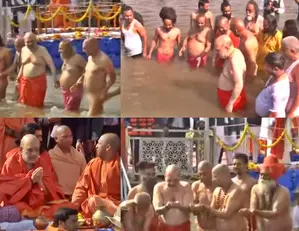 Home Minister Amit Shah takes holy dip in Sangam, CM Yogi accompanies him to ghat